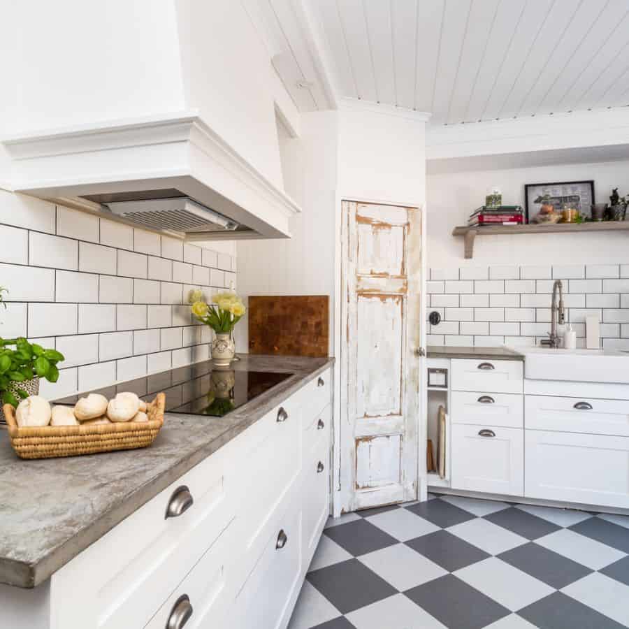 white corner kitchen with white tile backsplash 