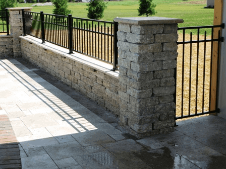 stone and metal fence 