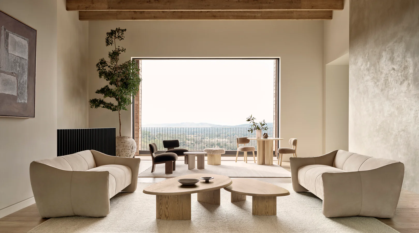 Spacious living room with beige sofas, wooden coffee tables, and large open window view.